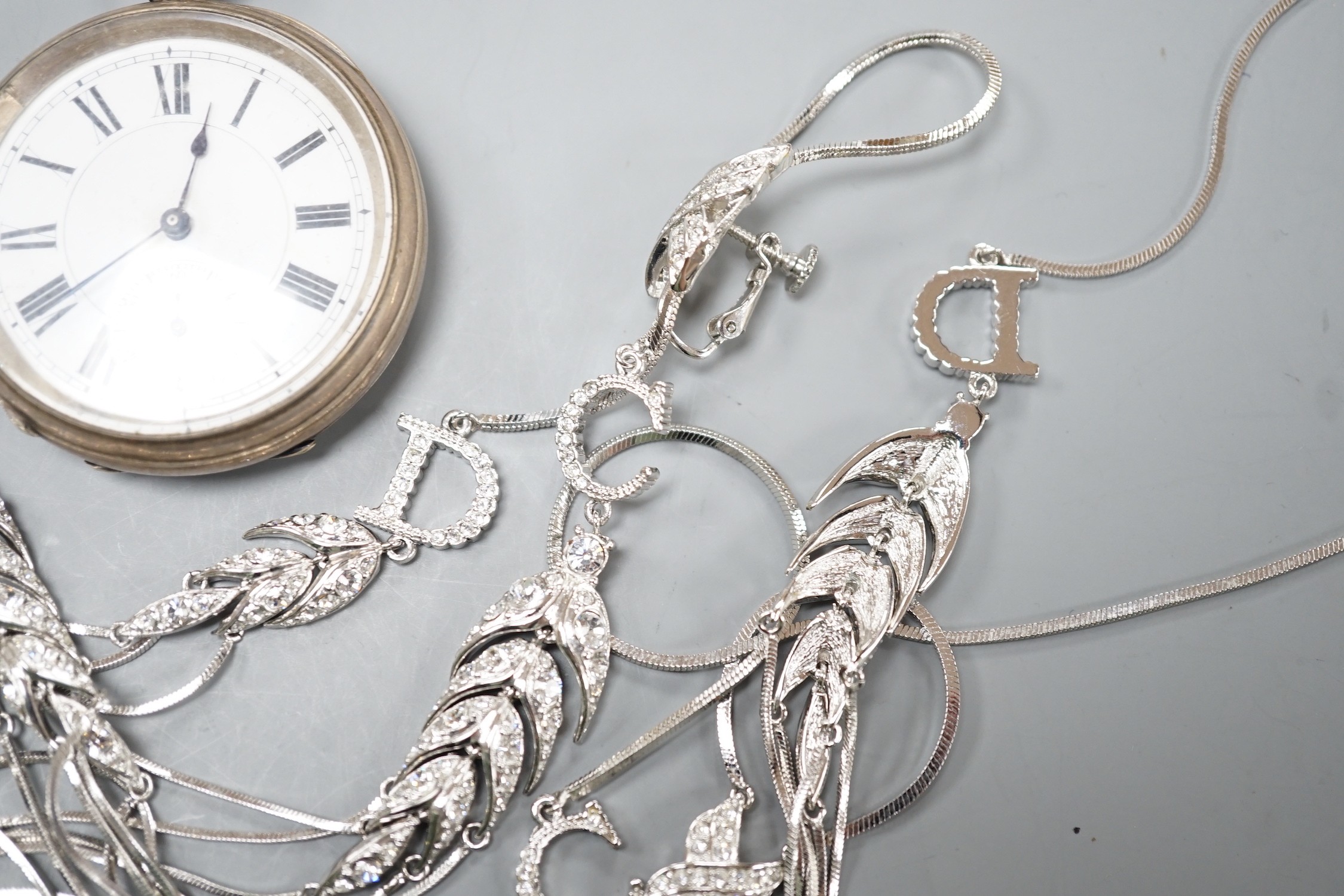 A Victorian silver open faced keywind pocket watch and a paste set suite of jewellery.